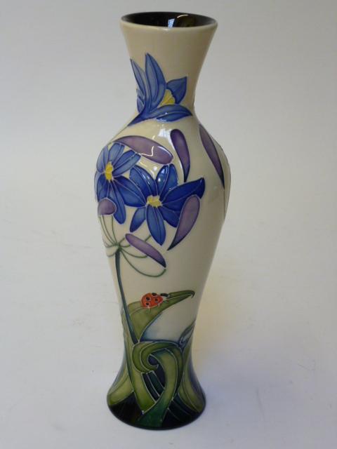 Appraisal: A MOORCROFT POTTERY VASE of slender inverted baluster form tube