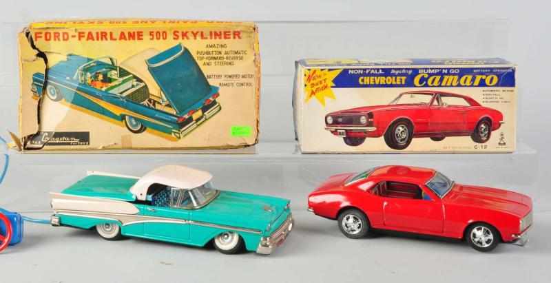 Appraisal: Lot of Tin Auto Friction Battery-Op Toys Japanese Includes two