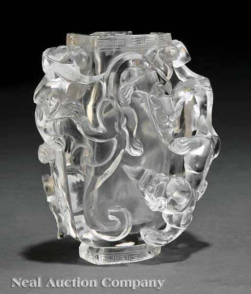 Appraisal: A Chinese Rock Crystal Chilong Vase hollowed baluster body carved