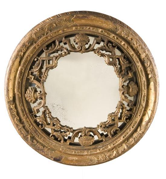 Appraisal: CONVEX MIRROR European th century Carved wooden and gilt frame