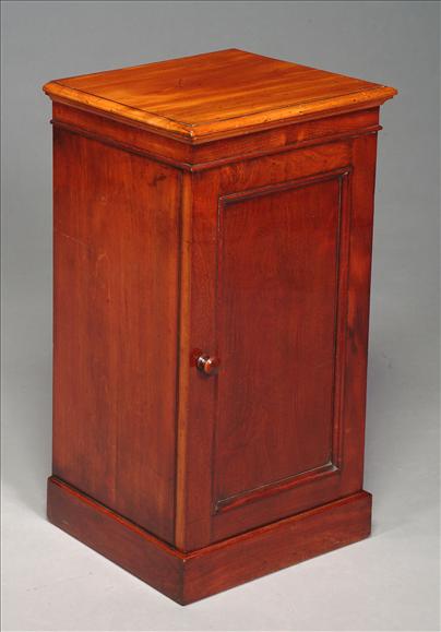 Appraisal: A Victorian mahogany bedside cabinet circa the top with moulded