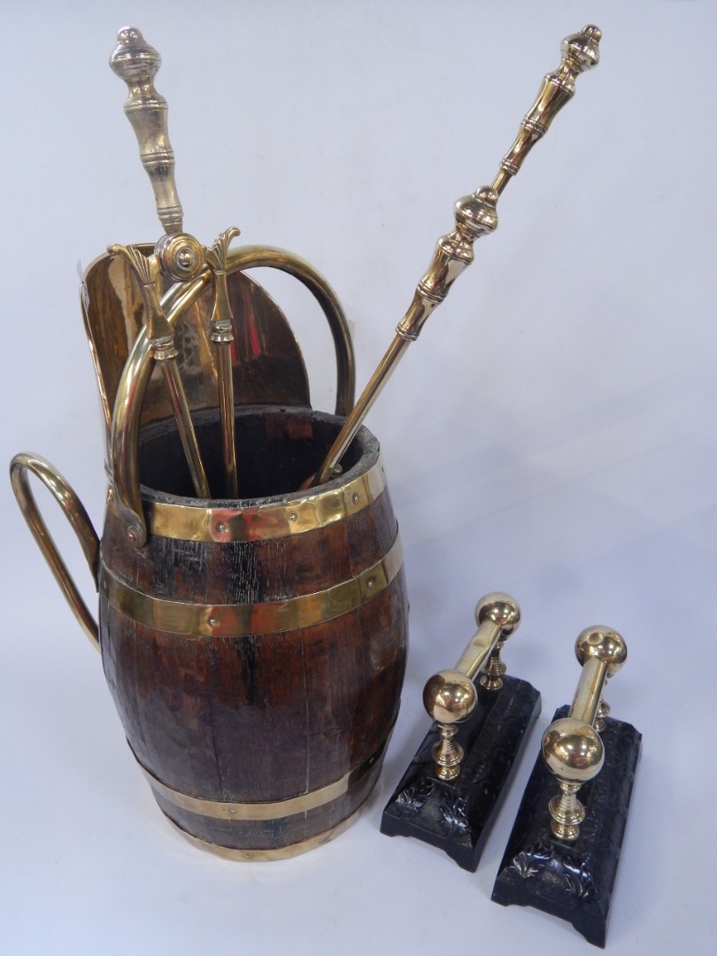 Appraisal: An oak and brass bound barrel coal scuttle brass shovel