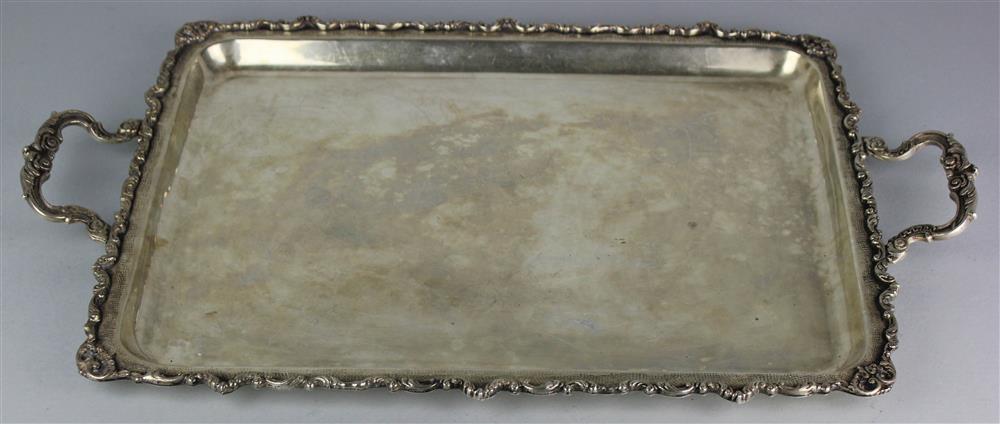 Appraisal: CONTINENTAL STANDARD RECTANGULAR TWO-HANDLED SERVING TRAY with applied scrolled borders