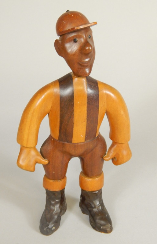 Appraisal: An unusual wooden carving in the form of a jockey