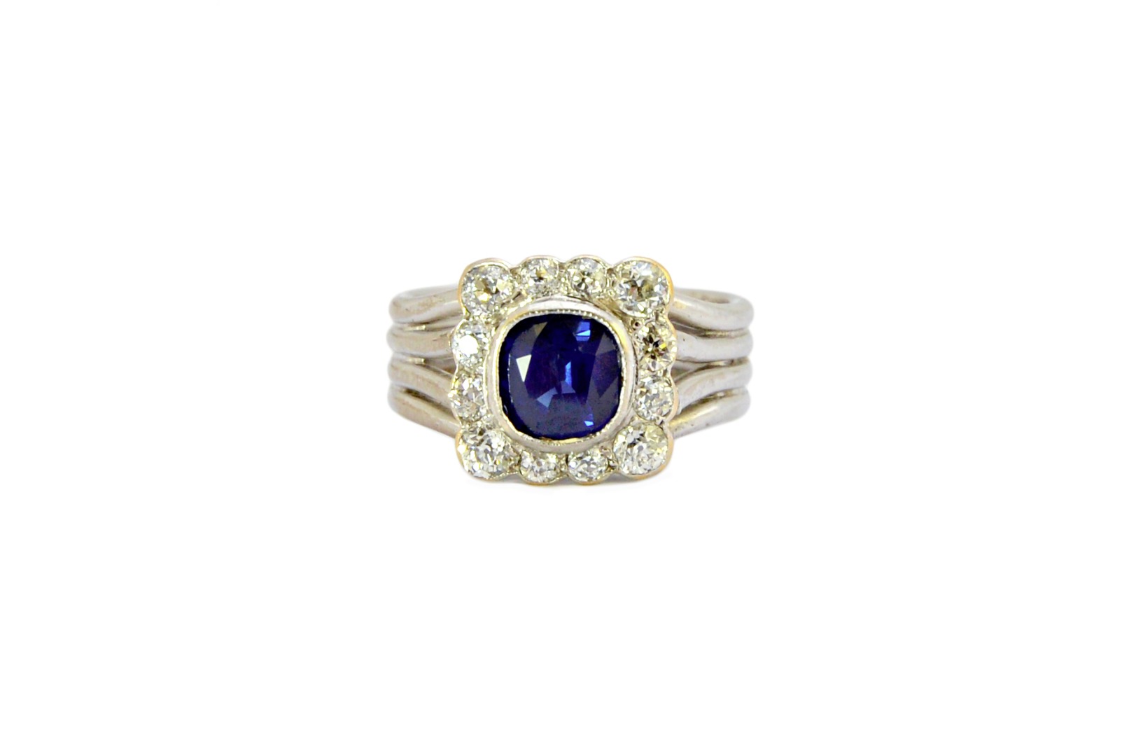 Appraisal: A sapphire and diamond set cluster ring mounted with the