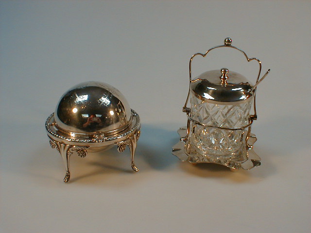 Appraisal: A silver plated jam pot and stand and silver plated