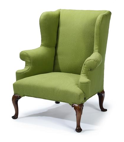 Appraisal: Georgian walnut upholstered wing armchair th century The straight backrest