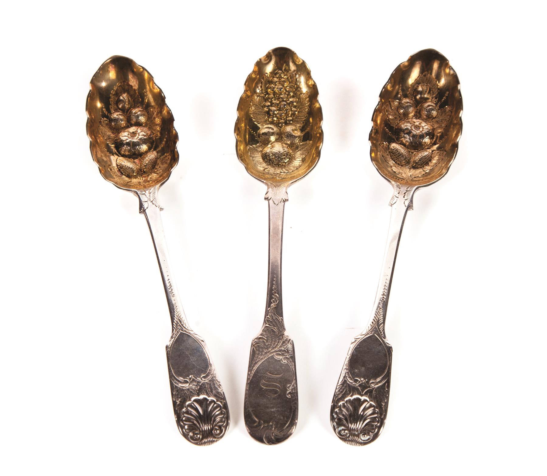 Appraisal: THREE STERLING SILVER SERVING SPOONS WITH LONDON HALLMARKS Beautifully embossed