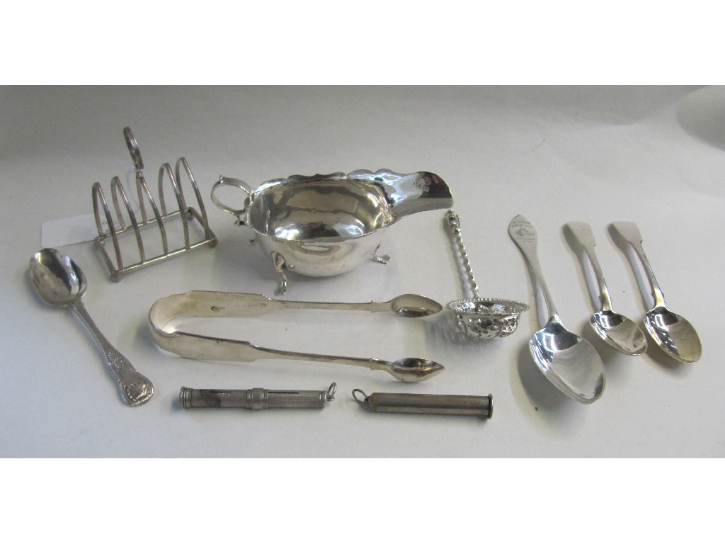 Appraisal: Lot comprising silver sauceboat toastrack tongs assorted silver spoons and