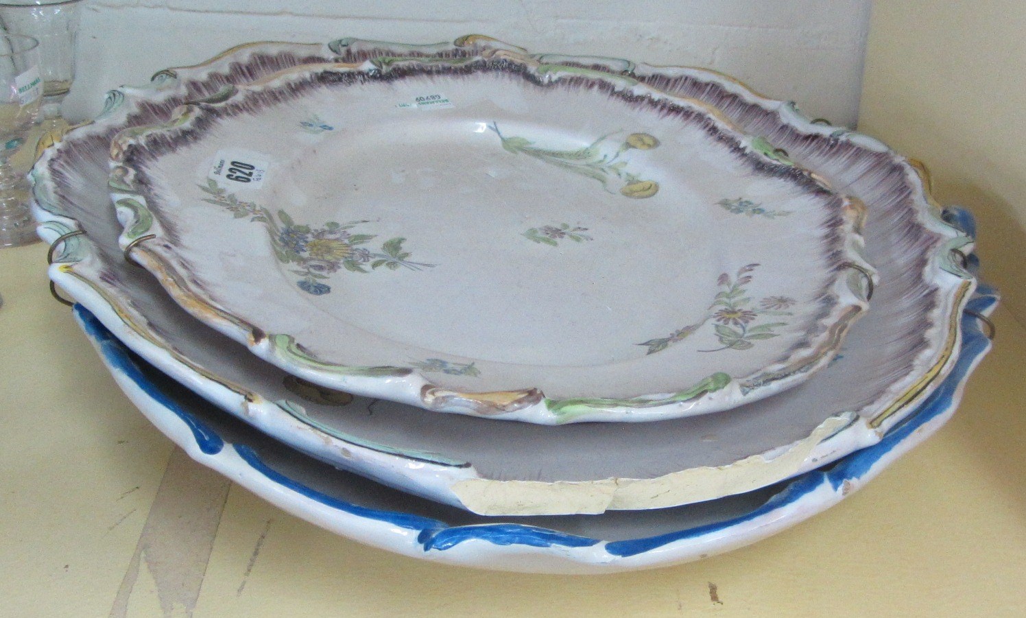 Appraisal: A Baltic faience sauceboat and a shaped oval platter th