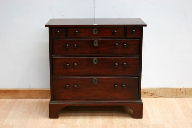 Appraisal: An early th century mahogany bachelors chest cm wide cm