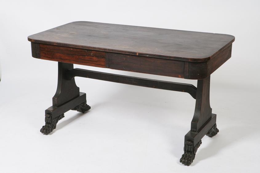 Appraisal: A REGENCY ROSEWOOD LIBRARY TABLE the rectangular top with rounded