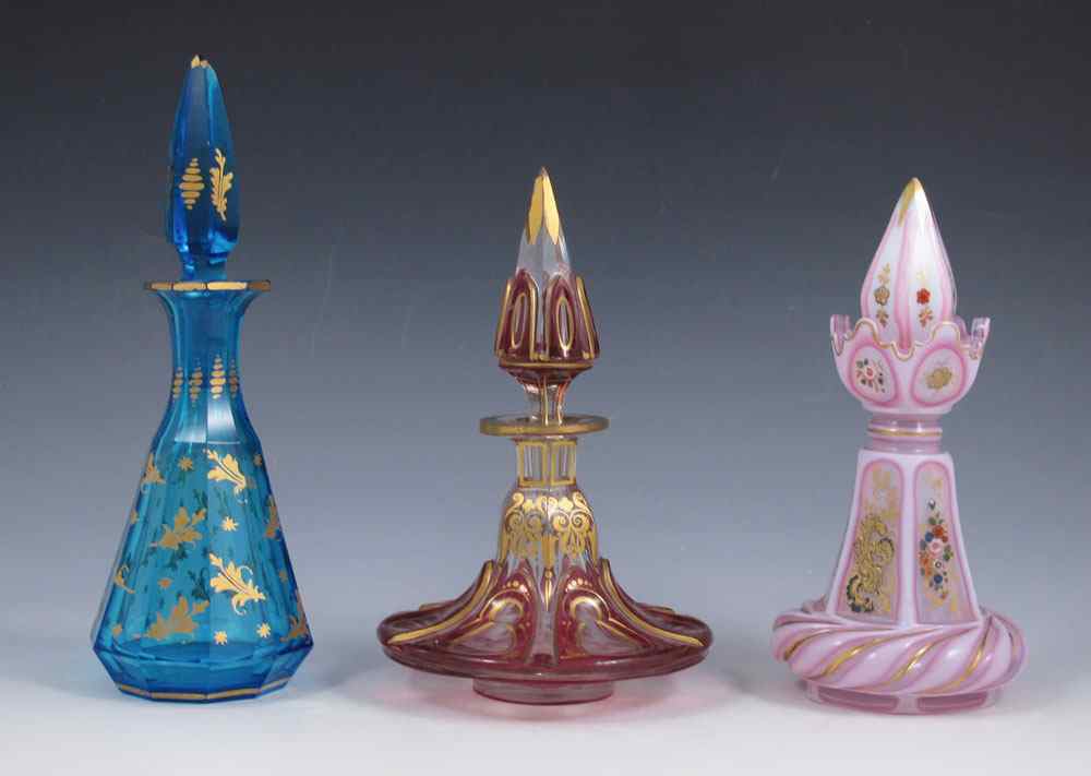 Appraisal: GROUP OF BOHEMIAN GLASS PERFUME BOTTLES Pink opaline with hand