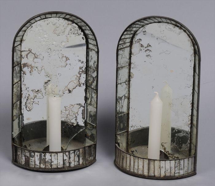 Appraisal: PAIR OF COLONIAL-STYLE MIRRORED TIN WALL SCONCES Each with arched