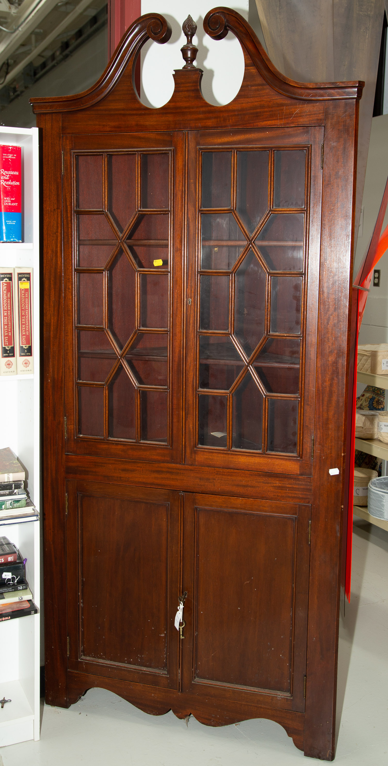 Appraisal: FEDERAL STYLE MAHOGANY CORNER CABINET Mid th century with mullioned