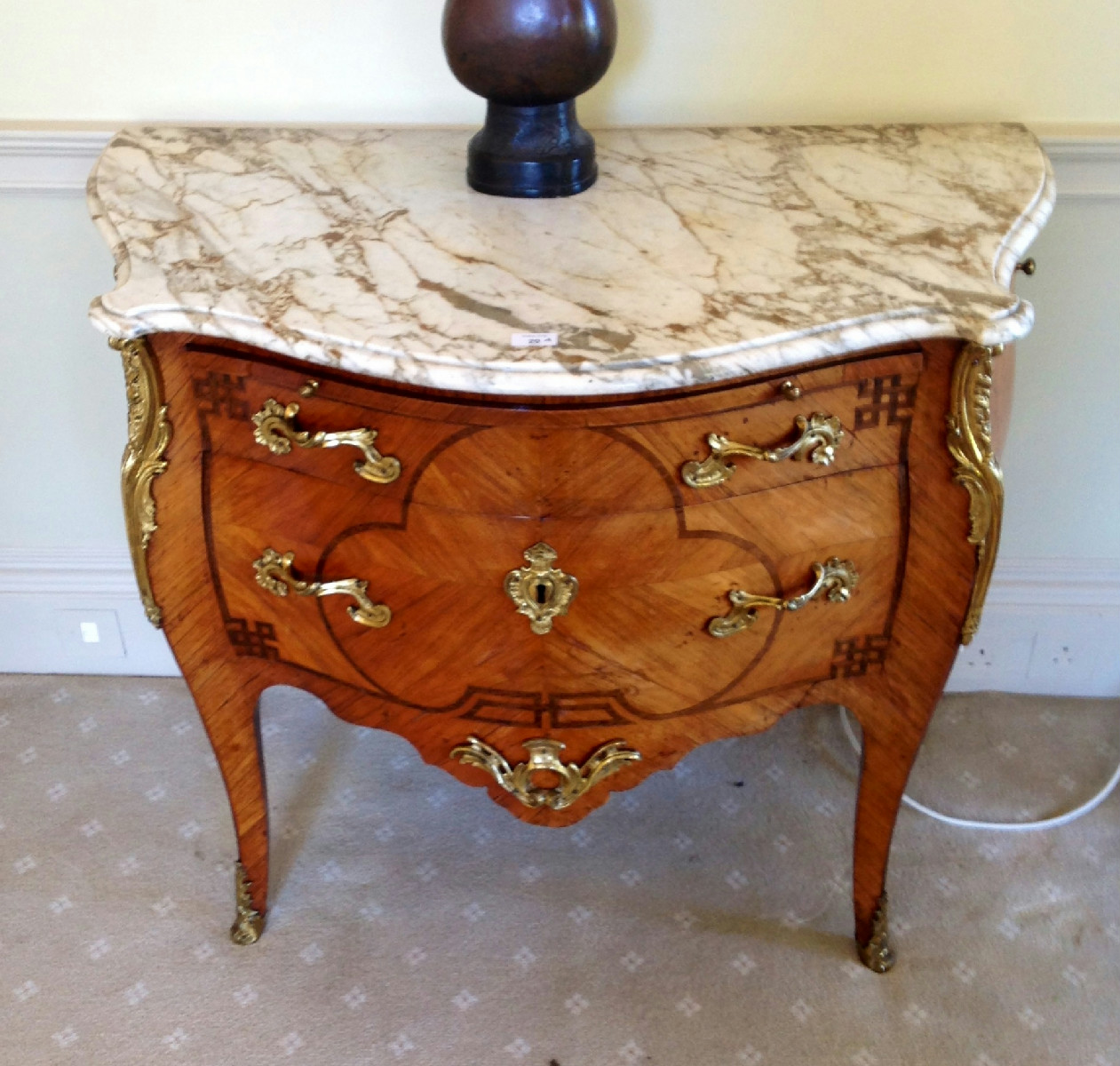 Appraisal: An thC French ormolu mounted tulip wood serpentine commode with