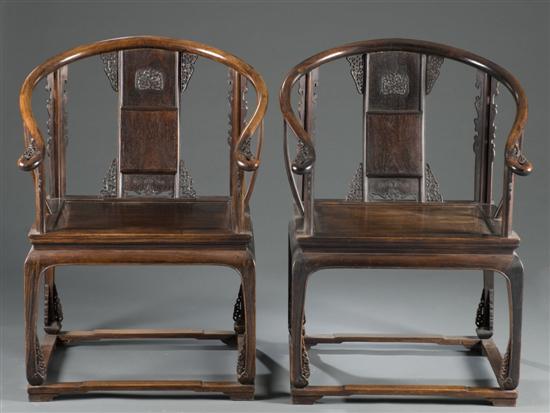 Appraisal: Pair of Chinese carved teak armchairs th century Horseshoe back