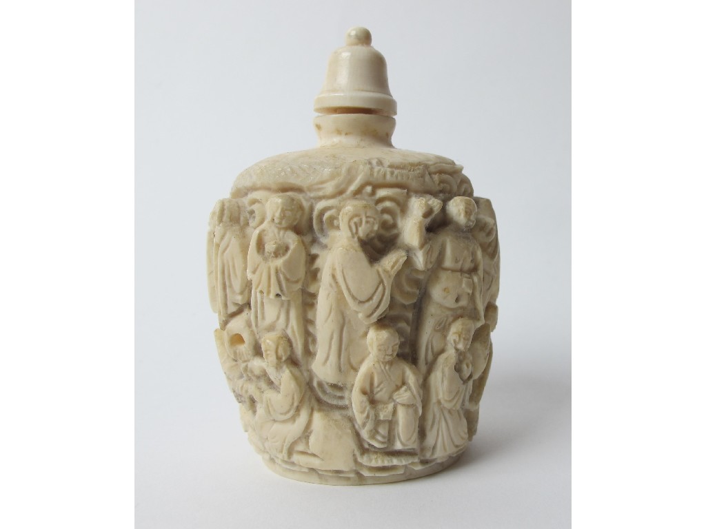 Appraisal: A Chinese carved ivory snuff bottle decorated with a frieze