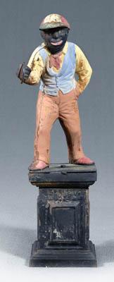 Appraisal: Figural cast iron lawn jockey painted cast iron with standing