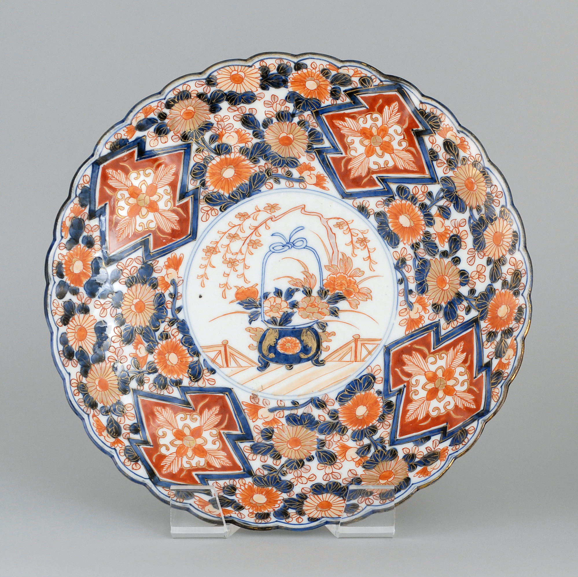 Appraisal: IMARI CHARGER Circa In flower form with flower basket center