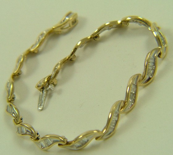 Appraisal: DIAMOND AND FOURTEEN KARAT GOLD BRACELET in length and set