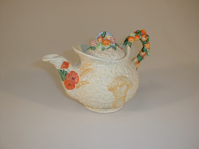 Appraisal: A Clarice Cliff Celtic harvest teapot with fruit cluster finial