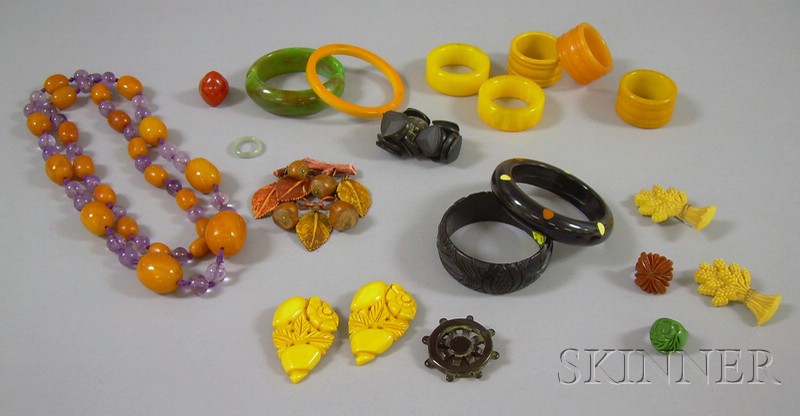 Appraisal: Group of Bakelite Jewelry including a carved bangle bracelet a