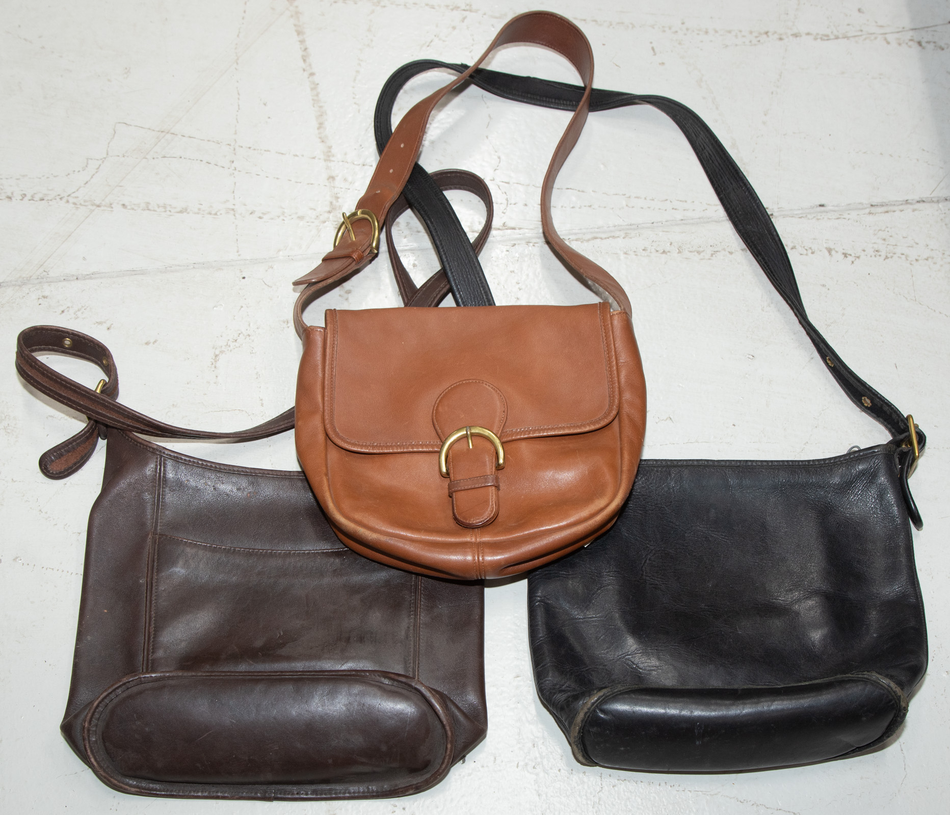 Appraisal: COACH HANDBAGS Includes three Coach leather bags