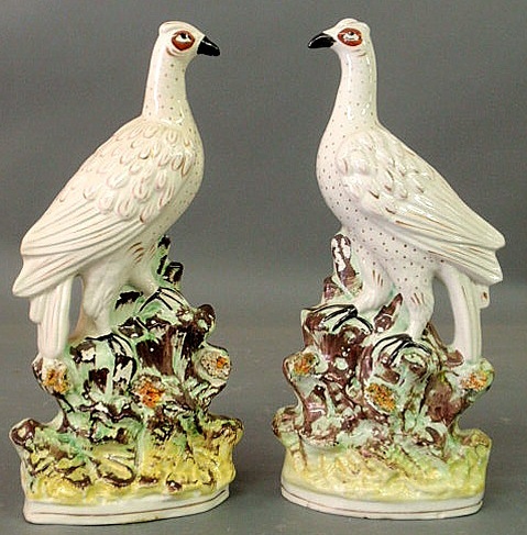 Appraisal: Pair of Staffordshire birds perched on rocks h x w