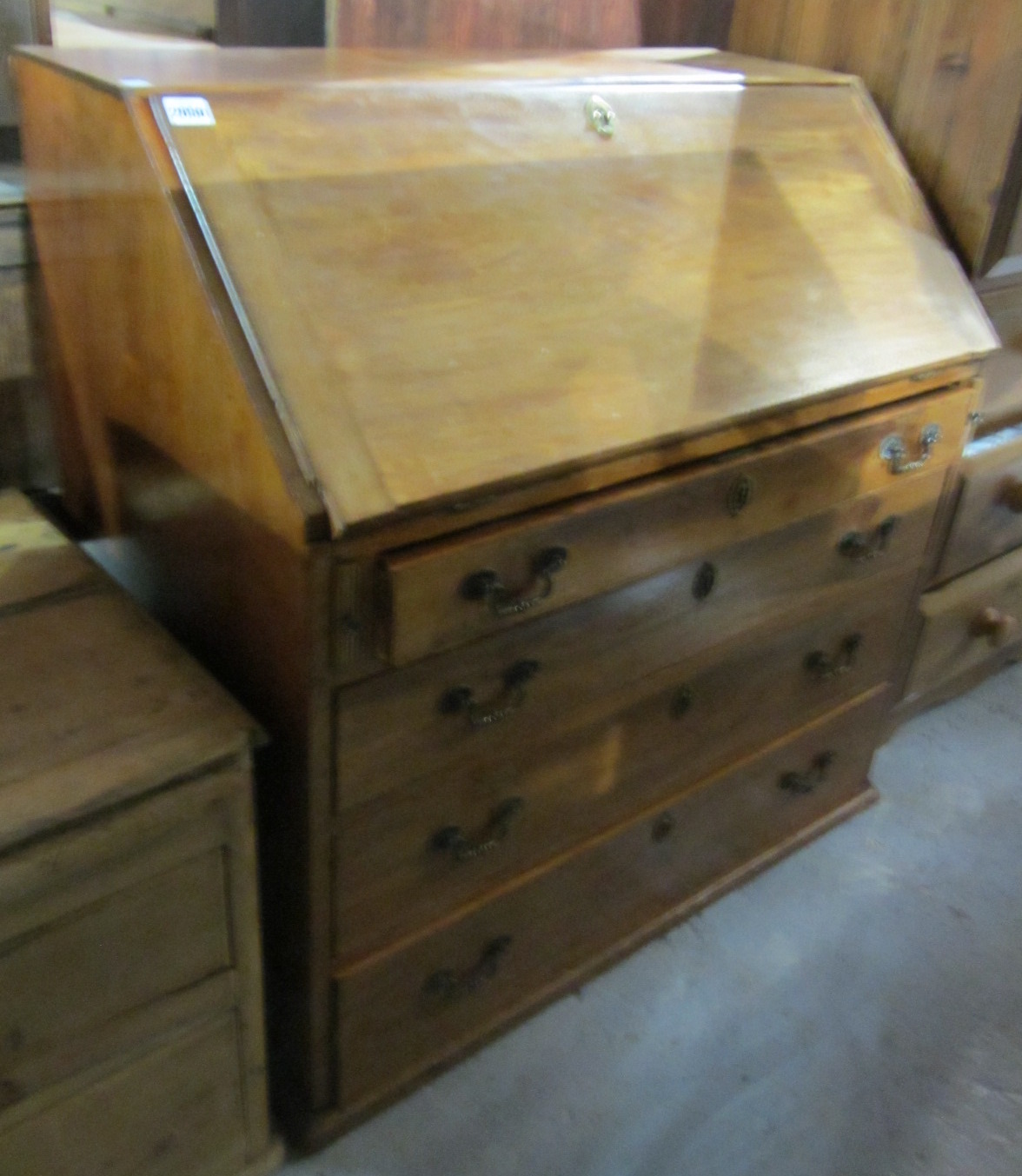 Appraisal: A th century mahogany bureau the fall over four long