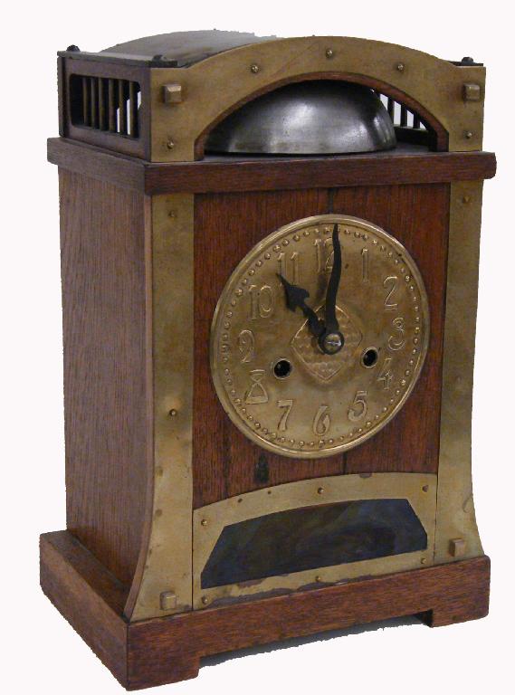 Appraisal: Oak Arts Crafts mantel clock the pressed brass dial over