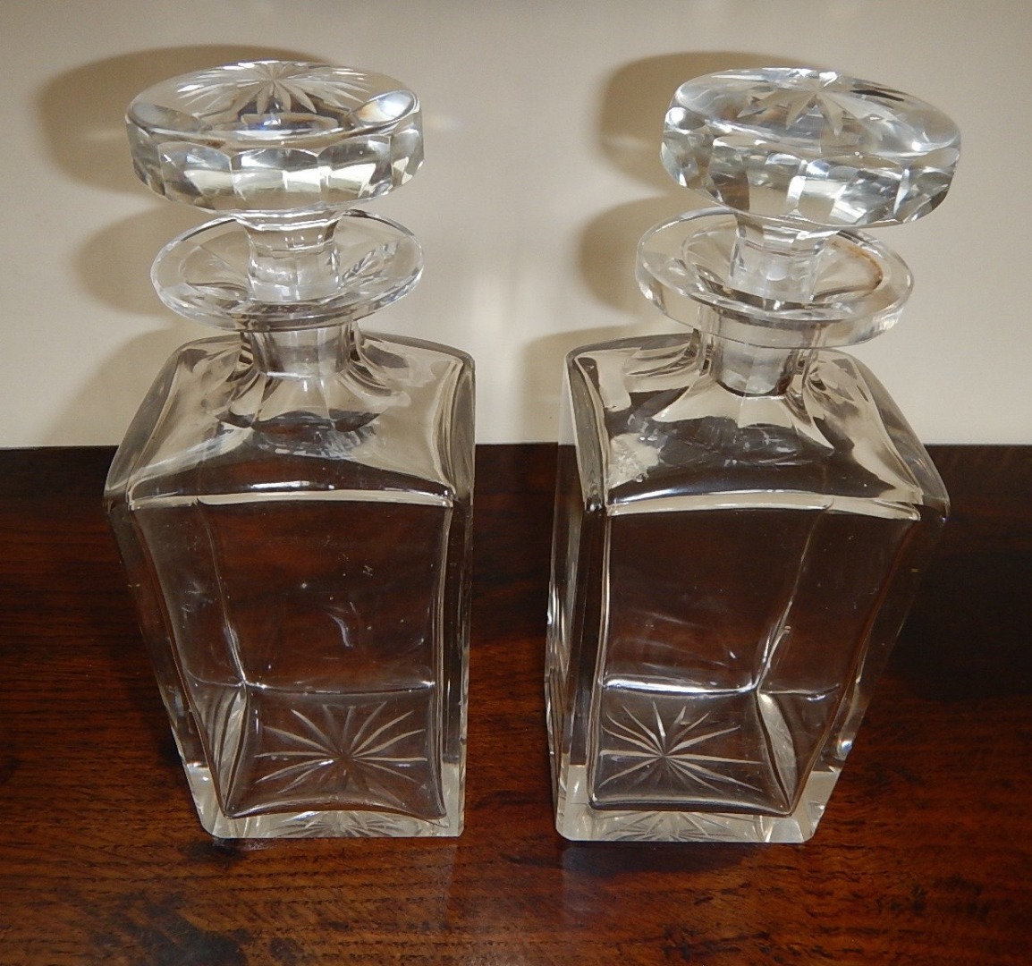 Appraisal: A pair of square section spirit decanters with slice cut