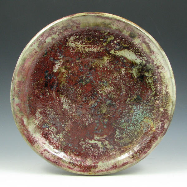 Appraisal: Lea Halpern charger or plate with volcanic or lava glaze