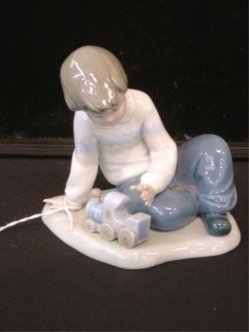 Appraisal: NAO BY LLADRO FIGURINE - BOY W TOY