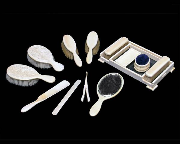 Appraisal: An English assembled ivory dressing set with two Anglo Indian