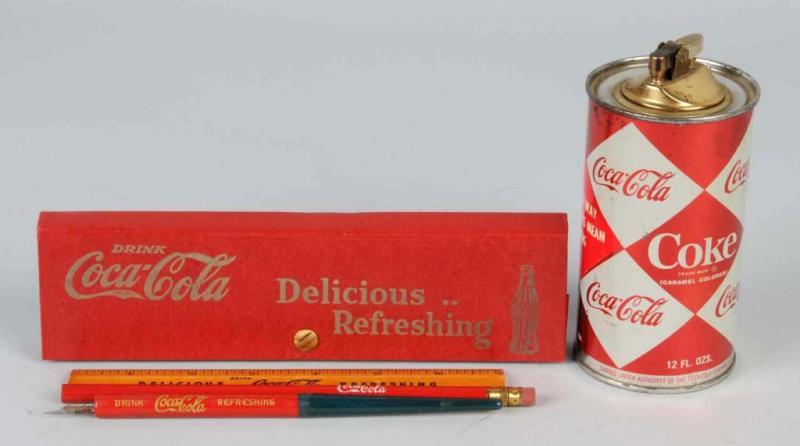 Appraisal: Lot of Coca-Cola Items Description Includes one Diamond Can lighter