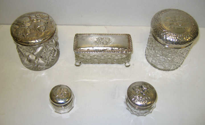 Appraisal: FIVE CUT GLASS AND SILVER VANITY JARS Various shapes each