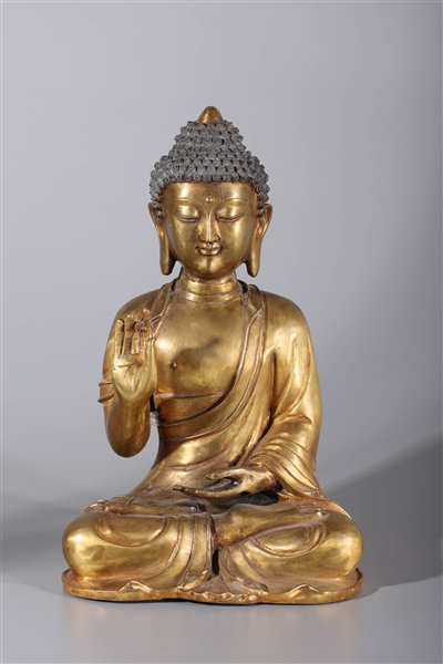 Appraisal: Tibetan Buddha gilt copper statue in traditional dhoti with stone