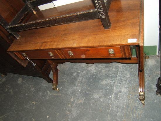 Appraisal: A reproduction mahogany sofa table with two frieze drawers the