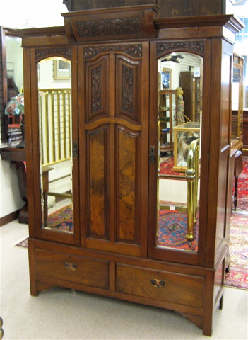 Appraisal: EDWARDIAN TWO-DOOR WALNUT WARDROBE English c - having a stepped