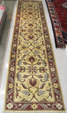 Appraisal: AN AFGHANI PERSIAN RUNNER overall floral design on khaki ground