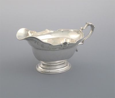 Appraisal: A modern copy of a George II sauceboat on a