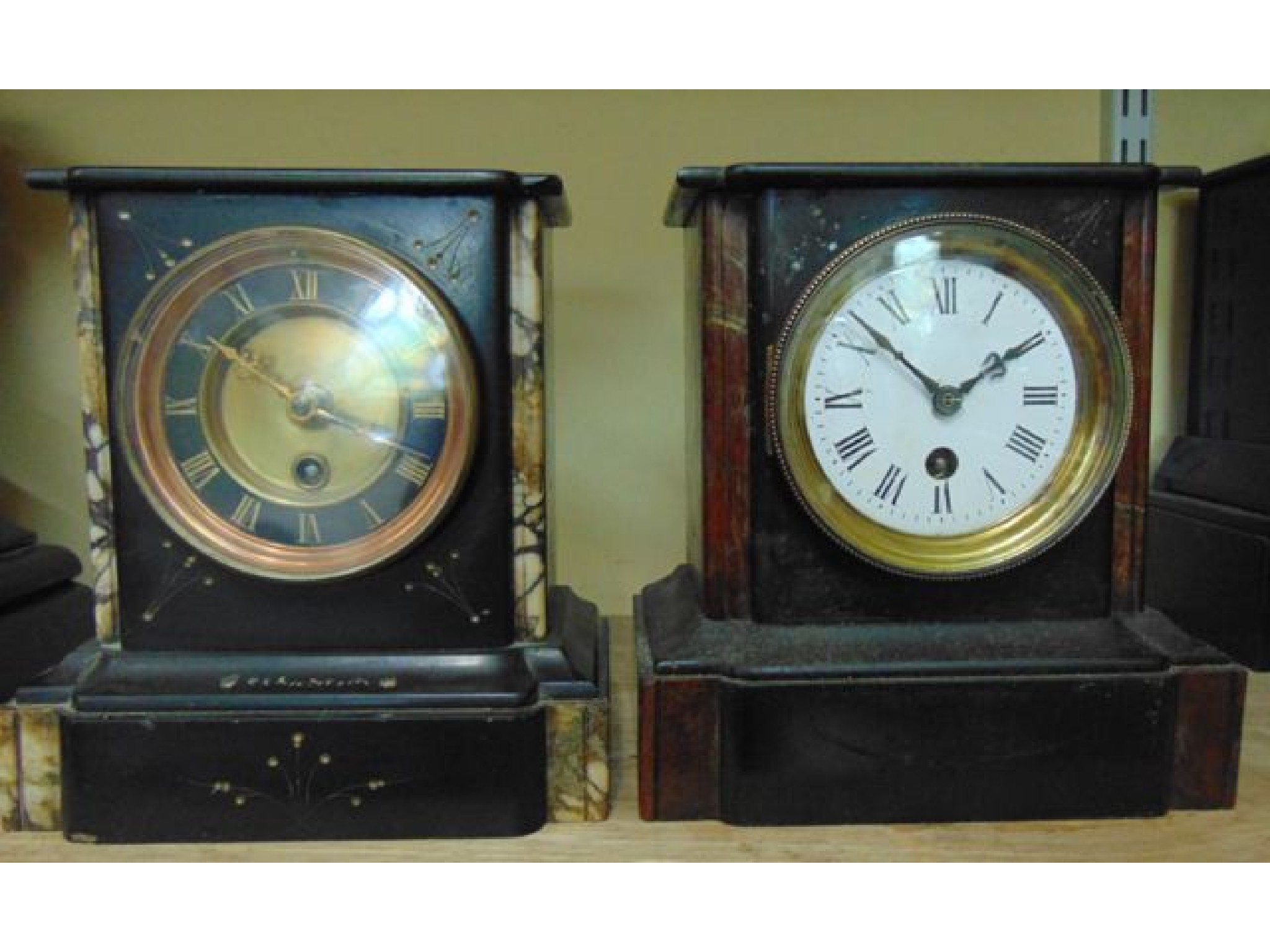 Appraisal: A Victorian black slate and polished marble mantle clock with