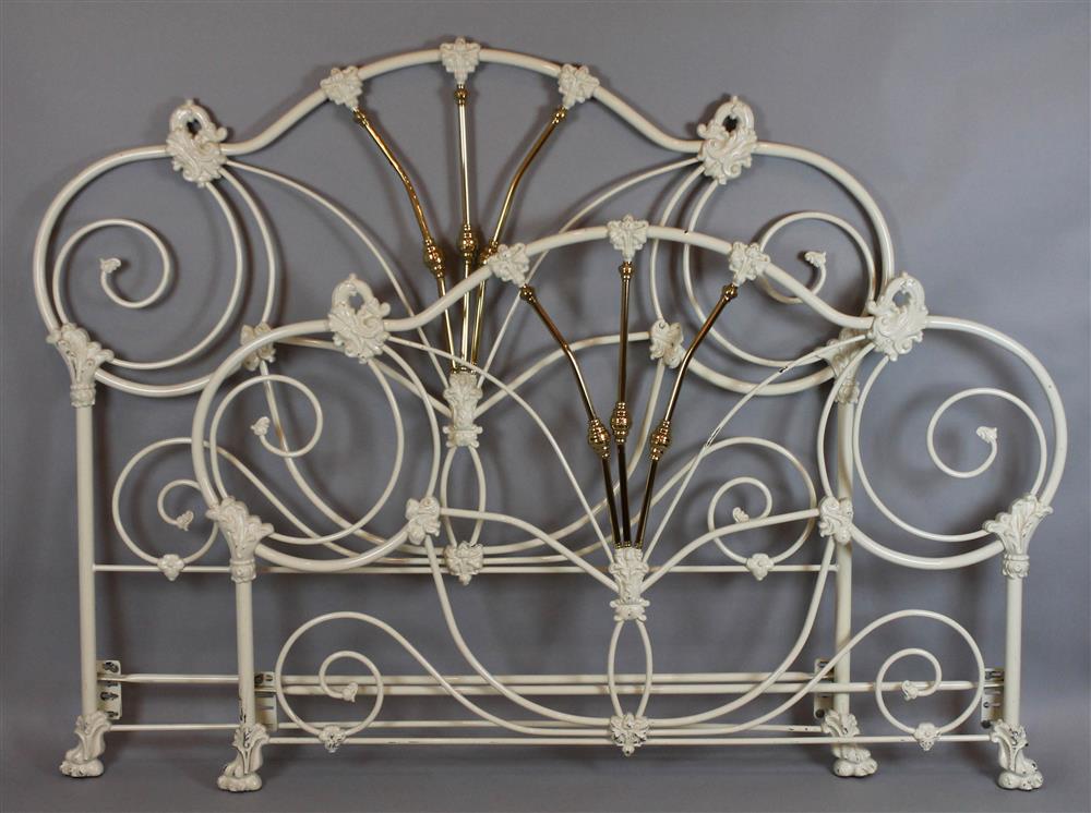 Appraisal: SCROLLING WHITE PAINTED IRON AND BRASS BED with both headboard