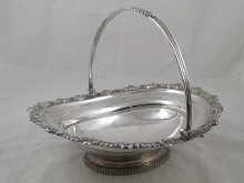 Appraisal: A George III silver swing handled oval cake basket with