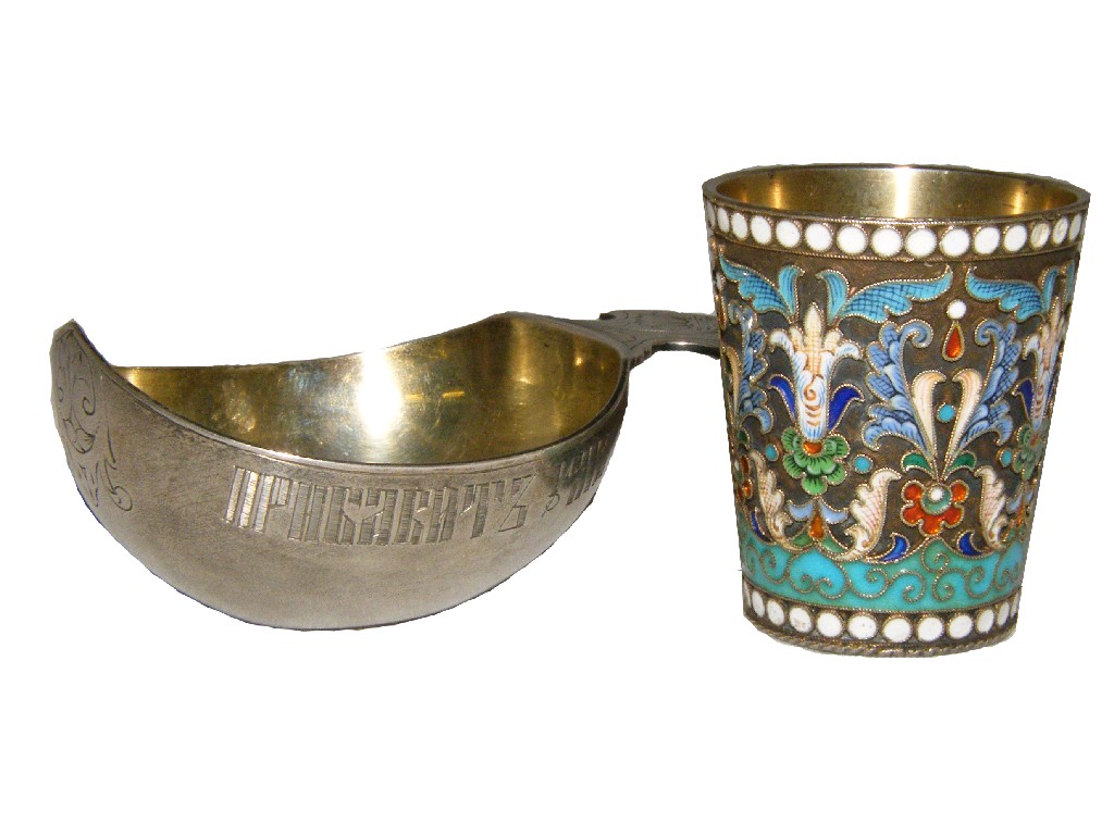 Appraisal: Russian silver Kovsh with a trefoil handle engraved with a