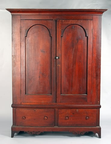 Appraisal: Cove-molded cornice twin tombstone paneled doors base with deep drawers