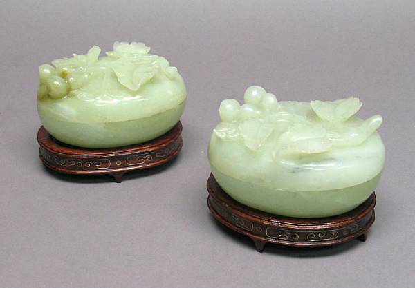 Appraisal: A pair of mottled pale green jade covered boxes Each