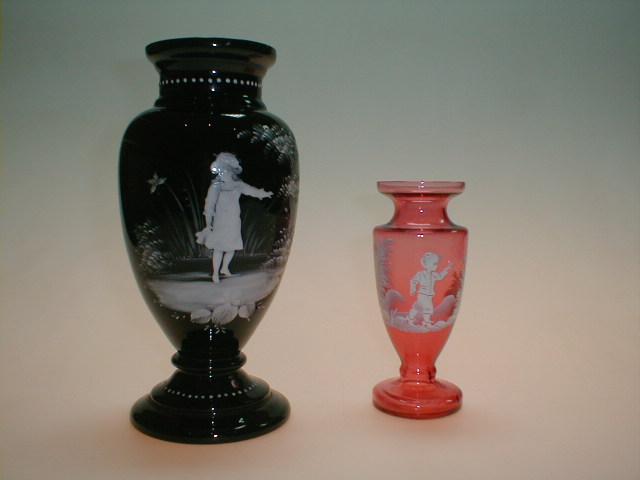 Appraisal: A black Mary Gregory style baluster glass vase enamelled in