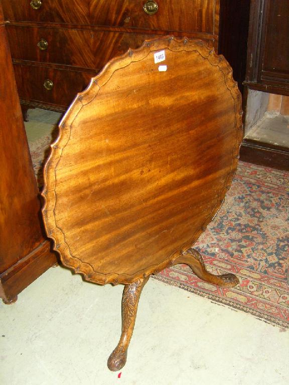 Appraisal: A Georgian style mahogany snap top occasional table with circular